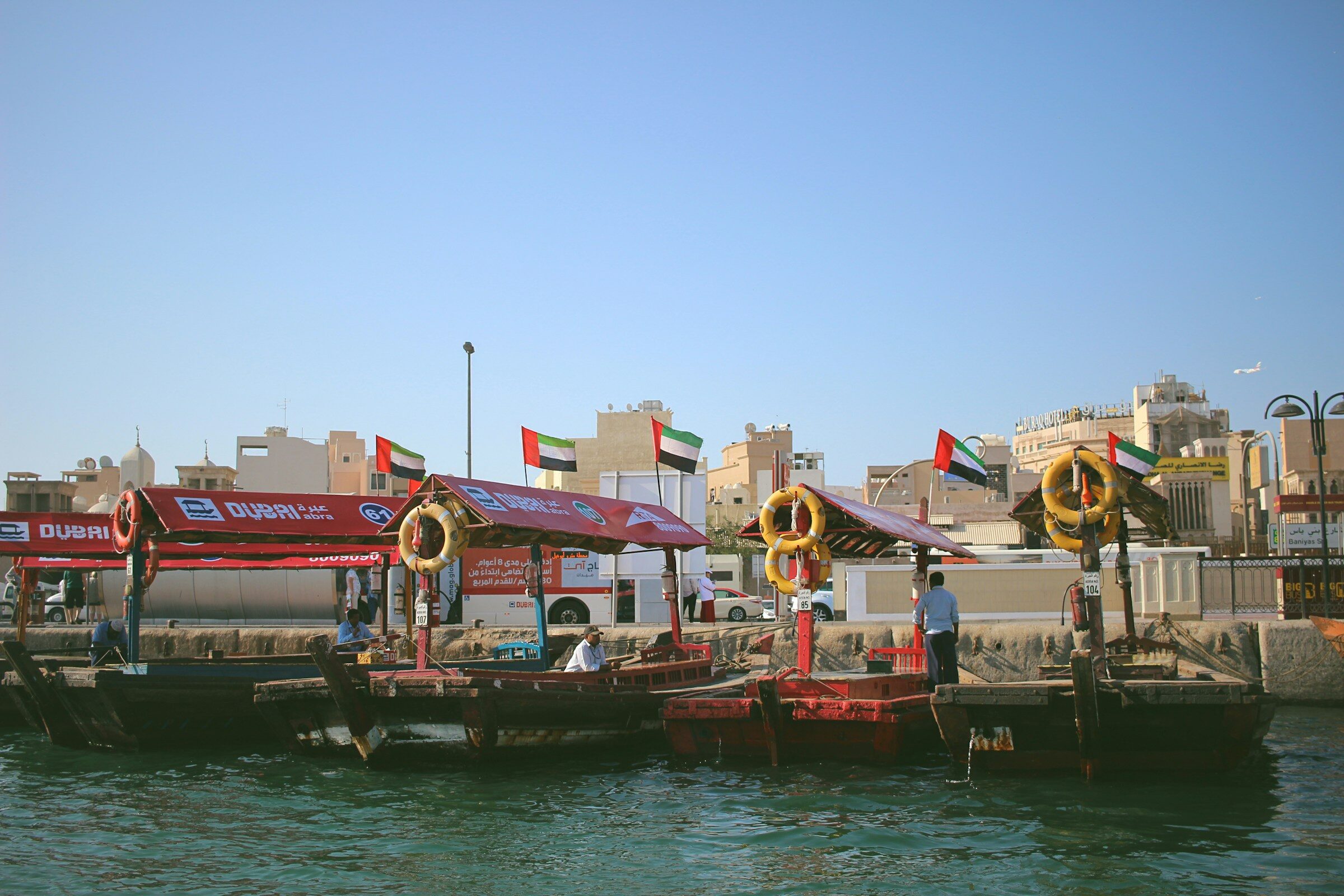 Abras moored beside the buildings of Dubai Creek