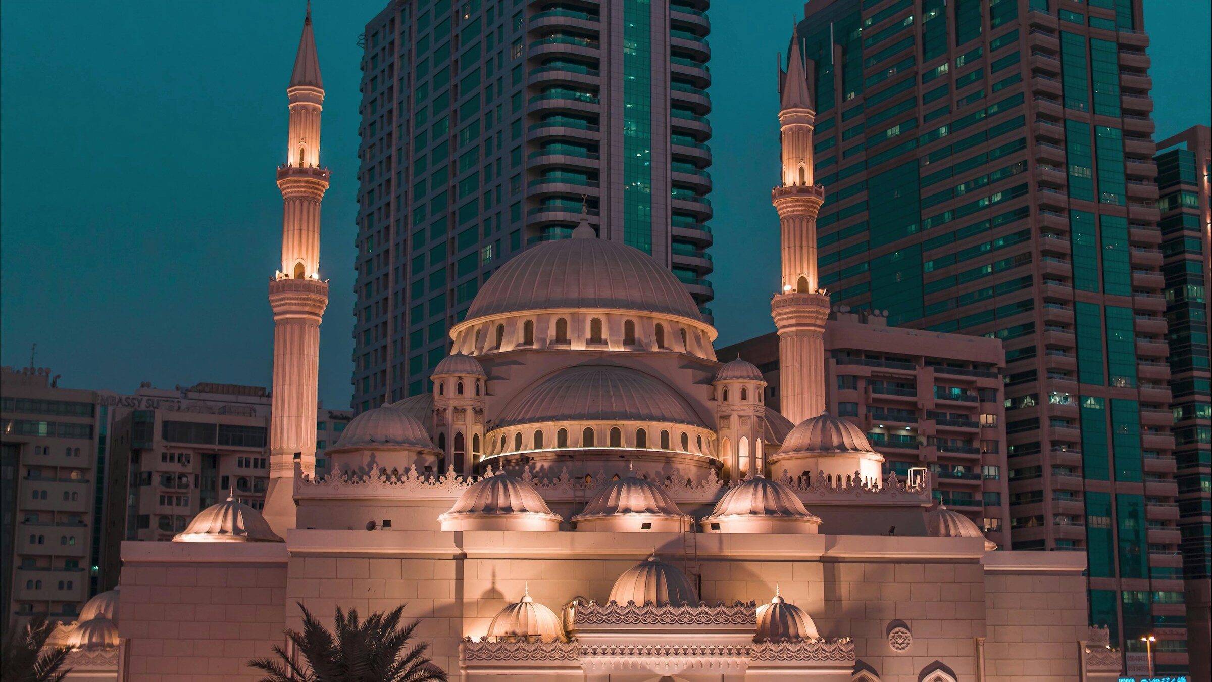 The Al Noor mosque and towers of central Sharjah at dusk
