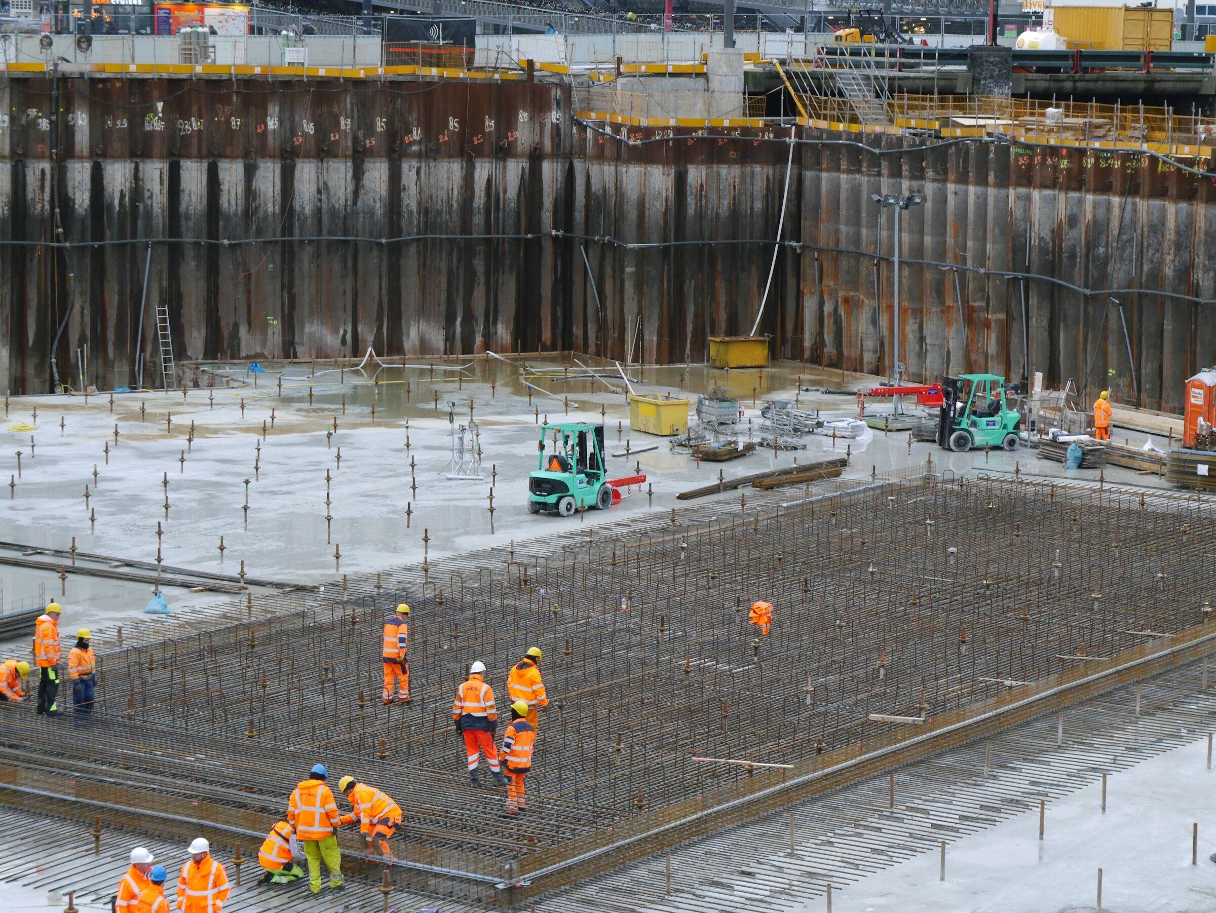 A group of construction workers around a site