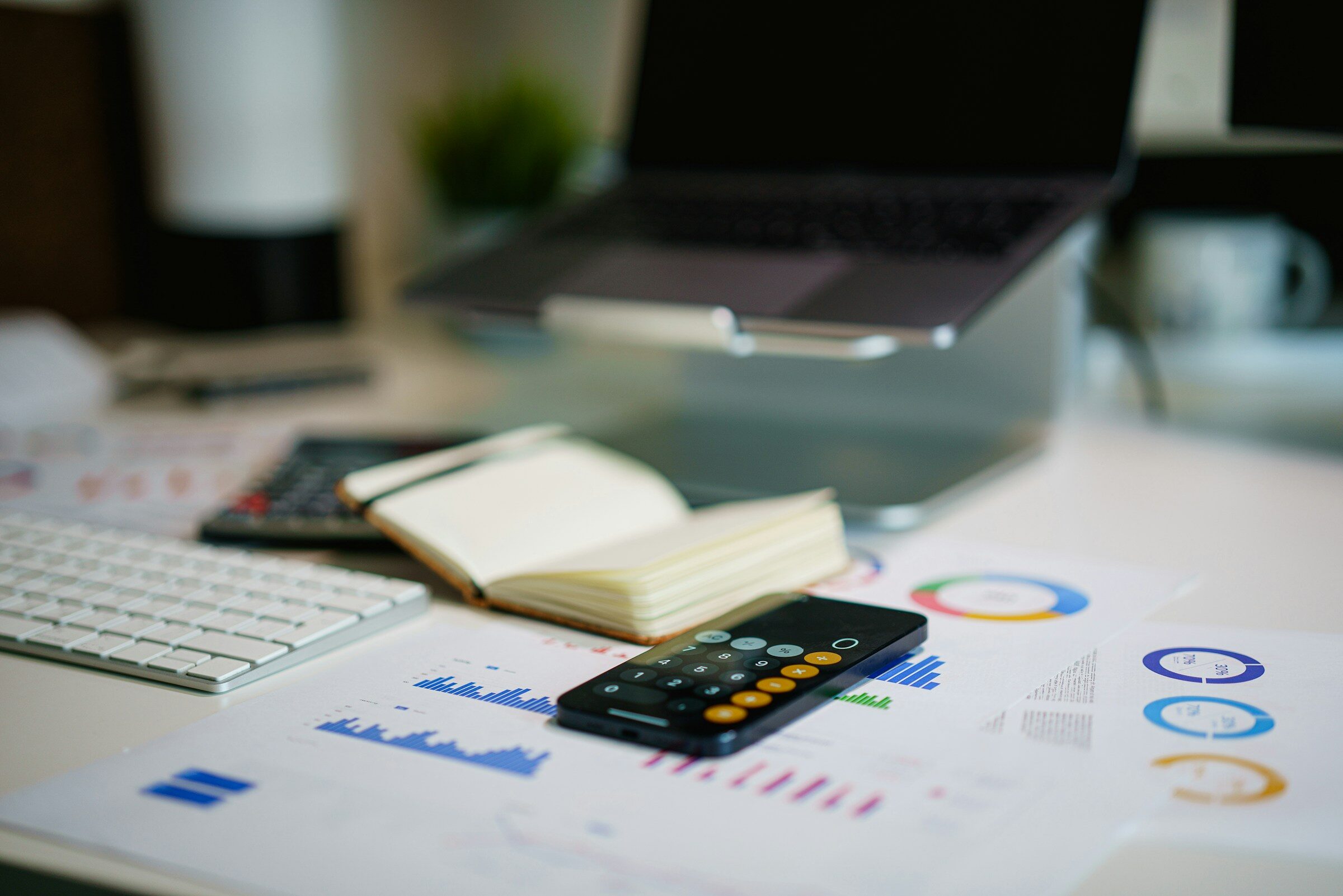 Financial charts and figures on a working office desk