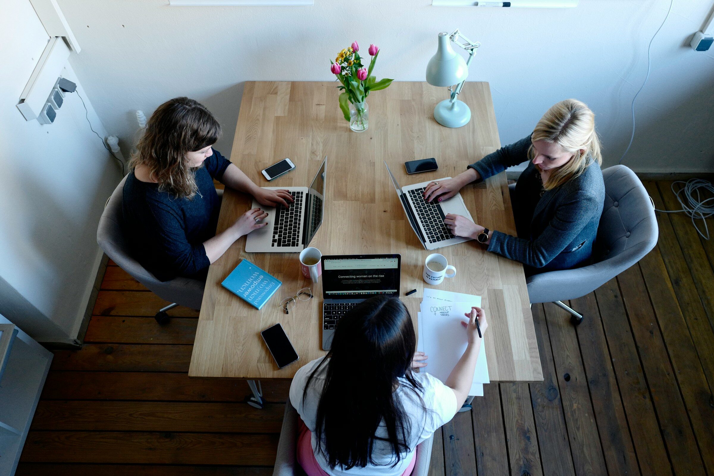 Colleagues working together, the people data an HRIS is the record of