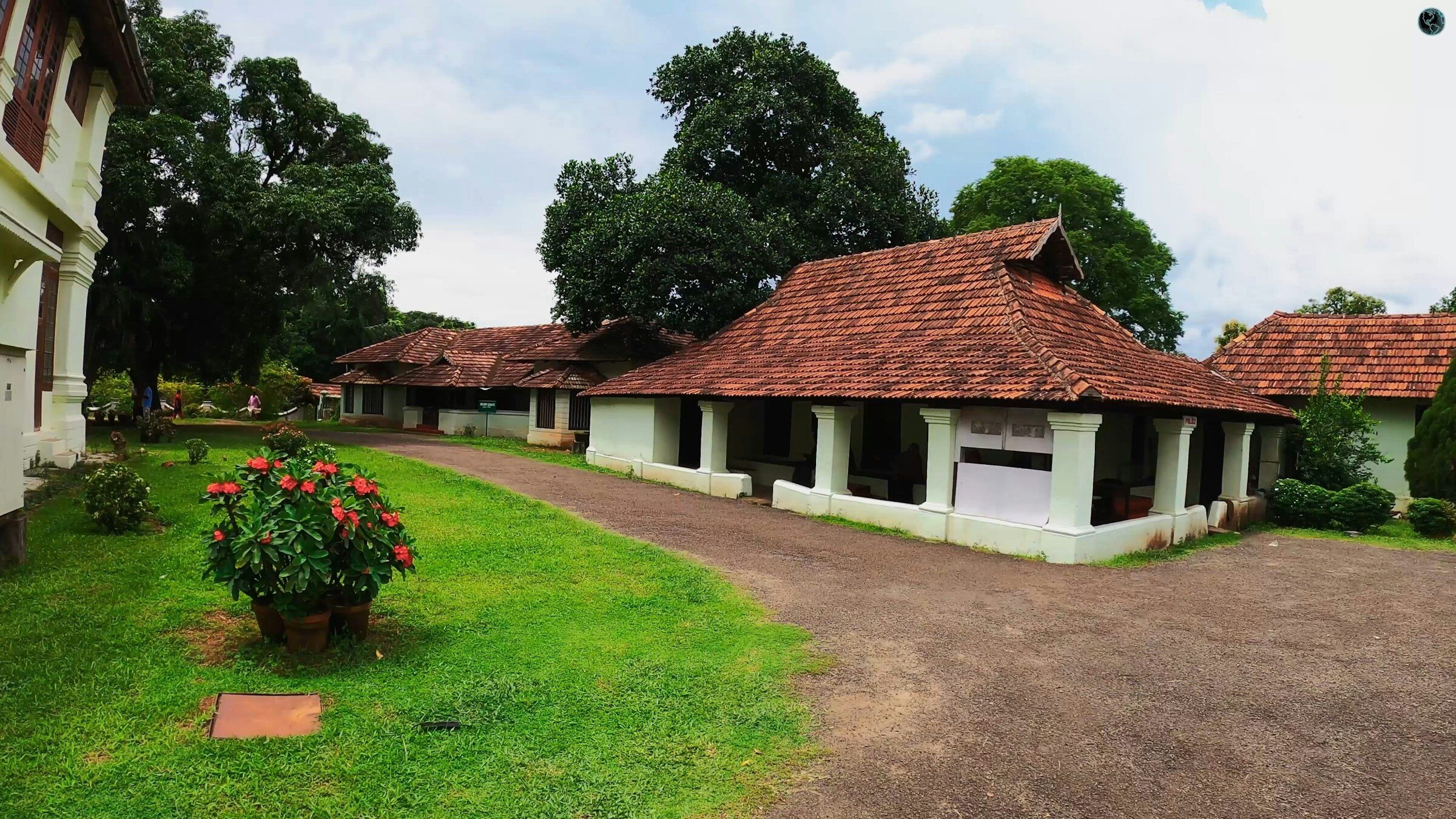 Buildings above the green Kerala backwaters