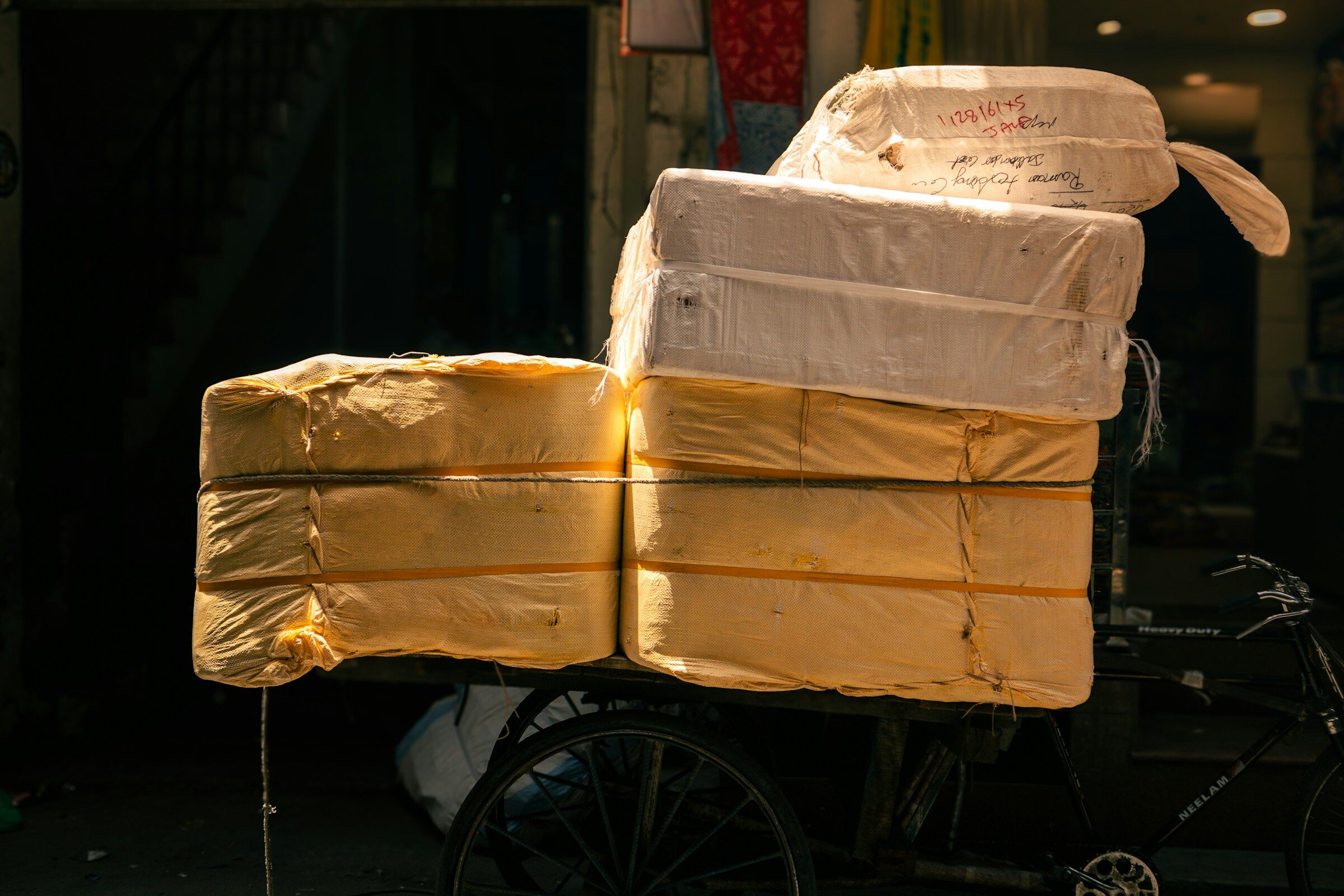 A bicycle heavily laden with wrapped parcels