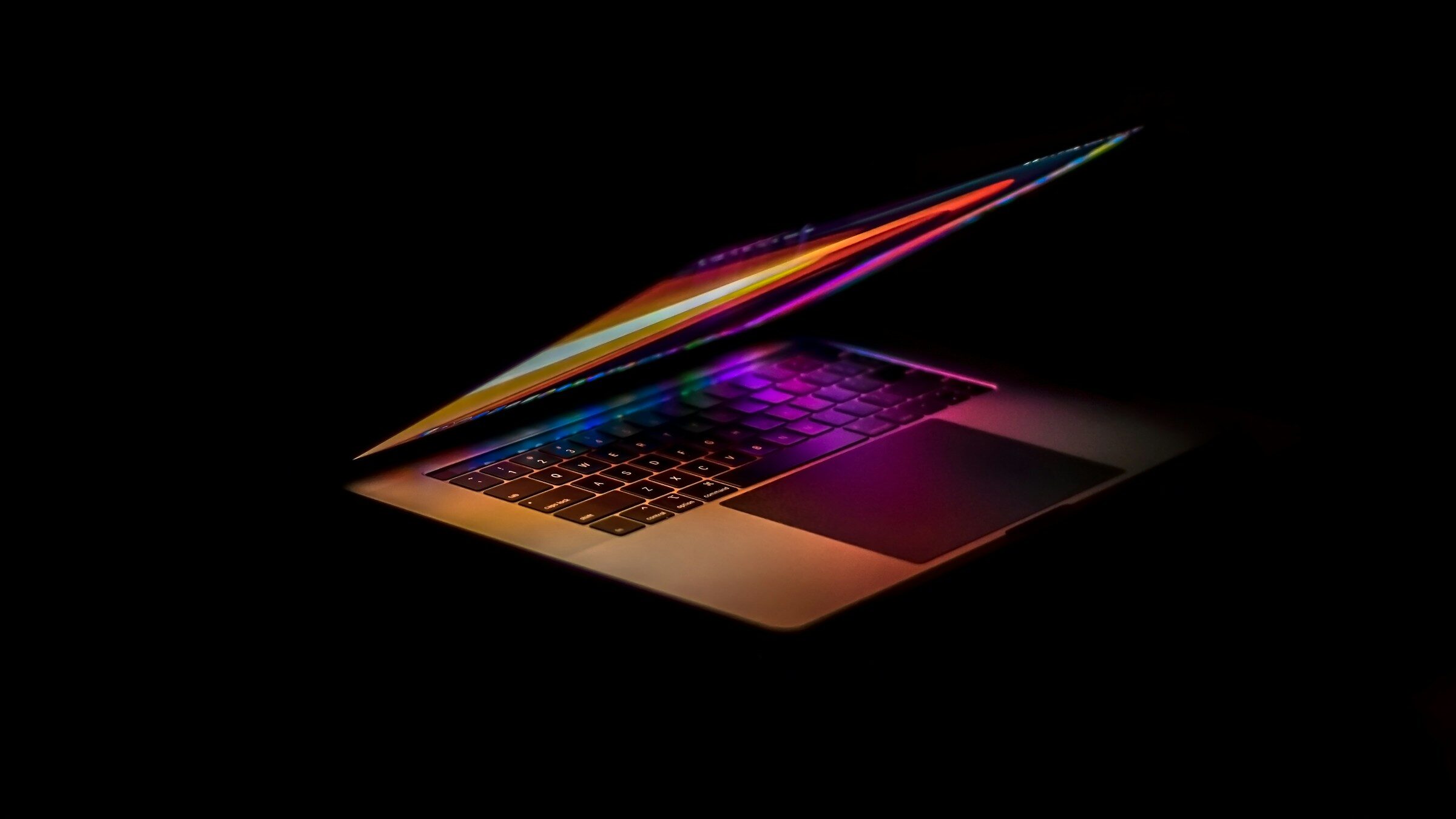 A laptop screen on a dark background