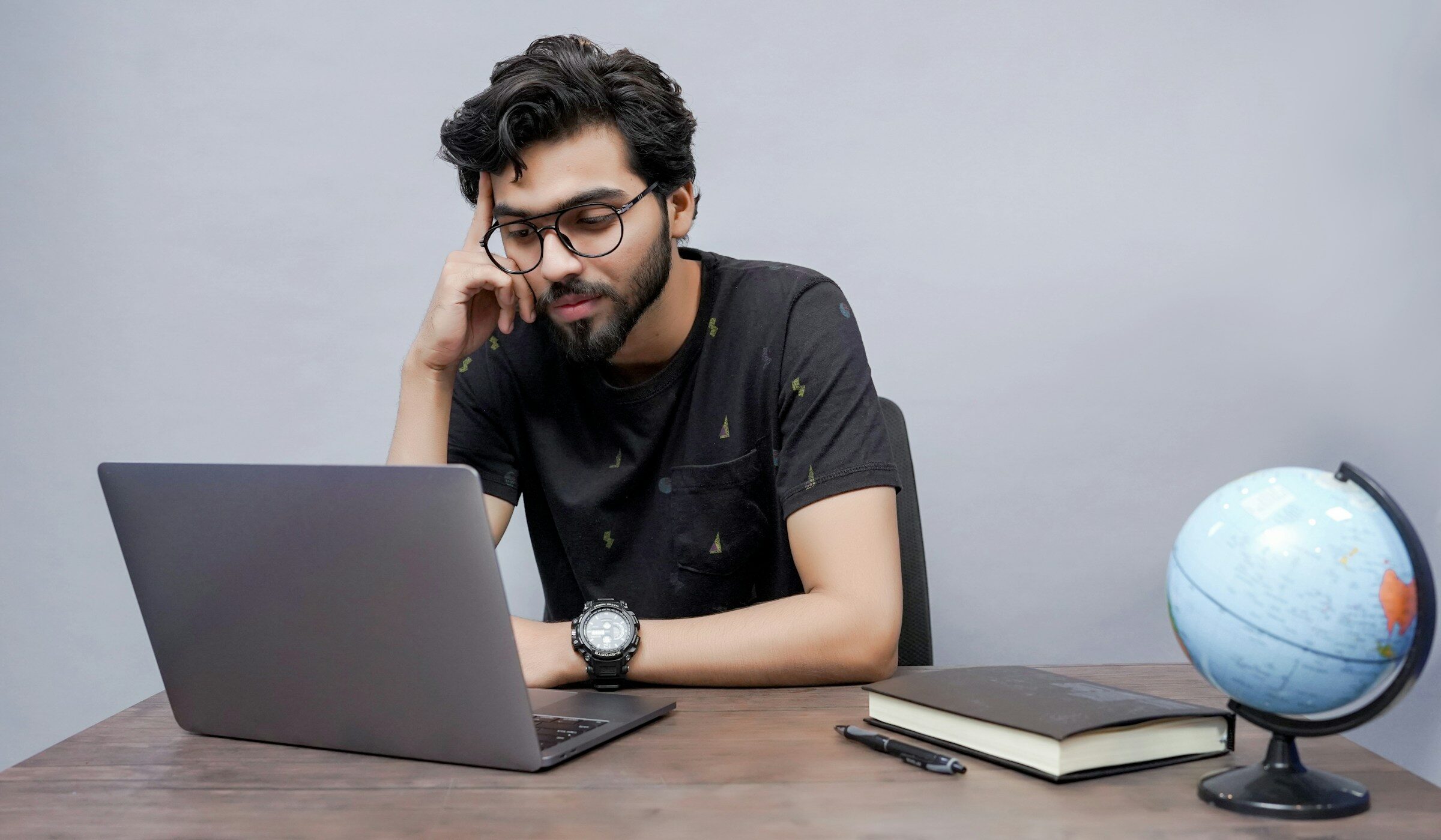 A man working alone at a laptop