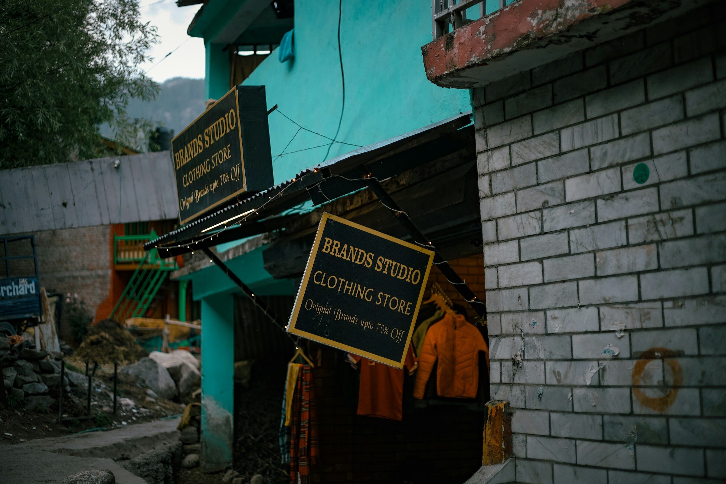 A shop sign on an Indian street