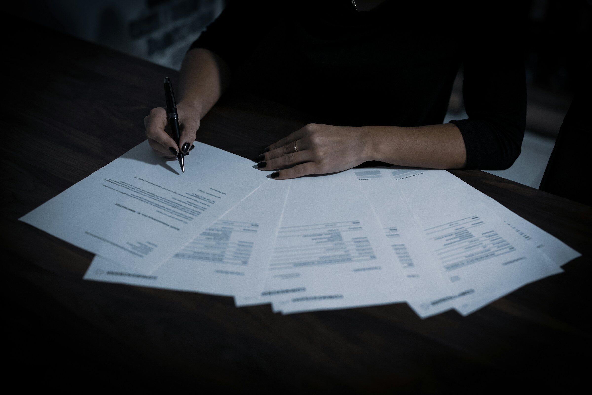 Operations review with paperwork and spreadsheets