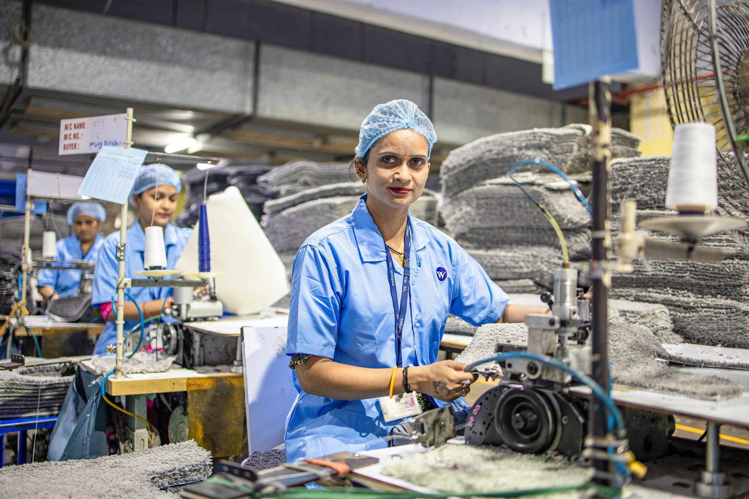 Workers operating machinery in a factory