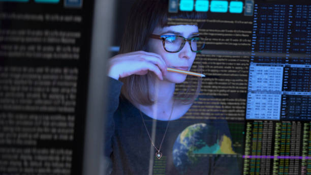 Analyst studying a wall of search-performance data