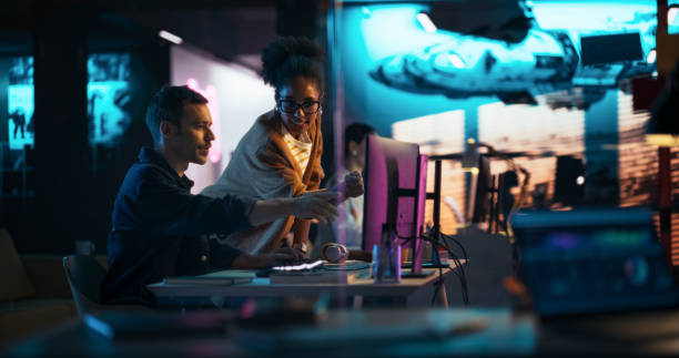 Designers comparing custom layouts and templates in a studio