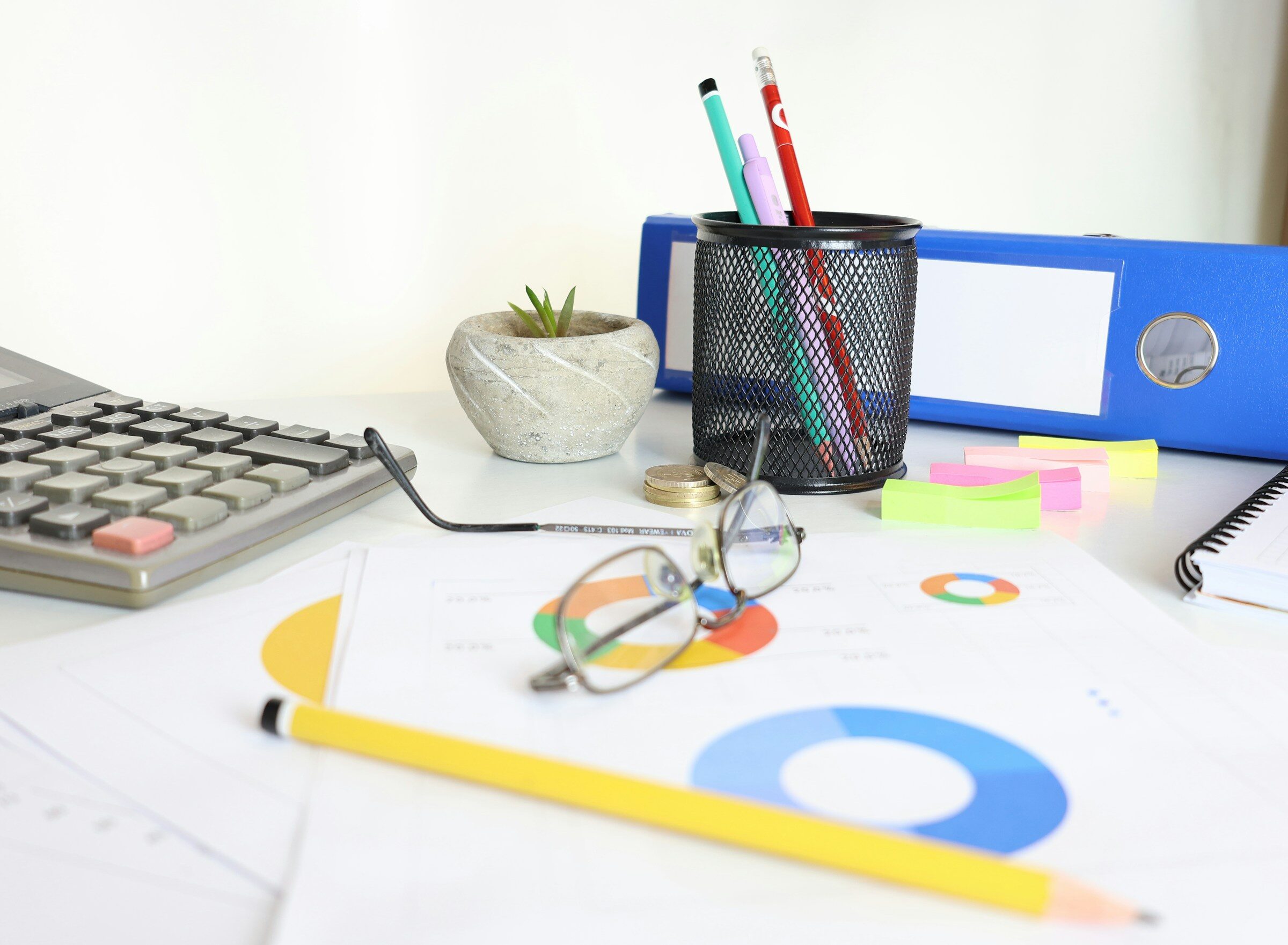 Printed charts and glasses on a reporting desk