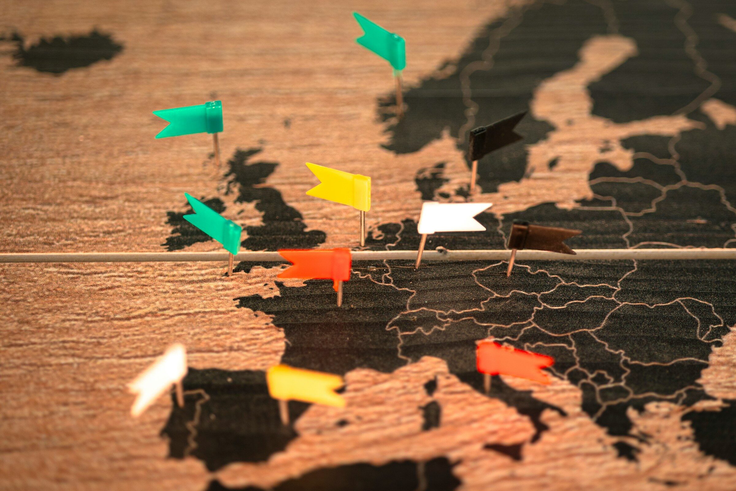 A world map marked with pins