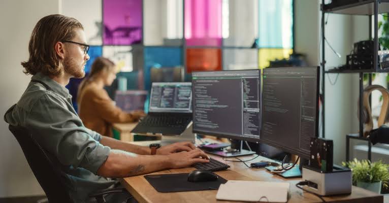 Developer building a website in a modern studio office