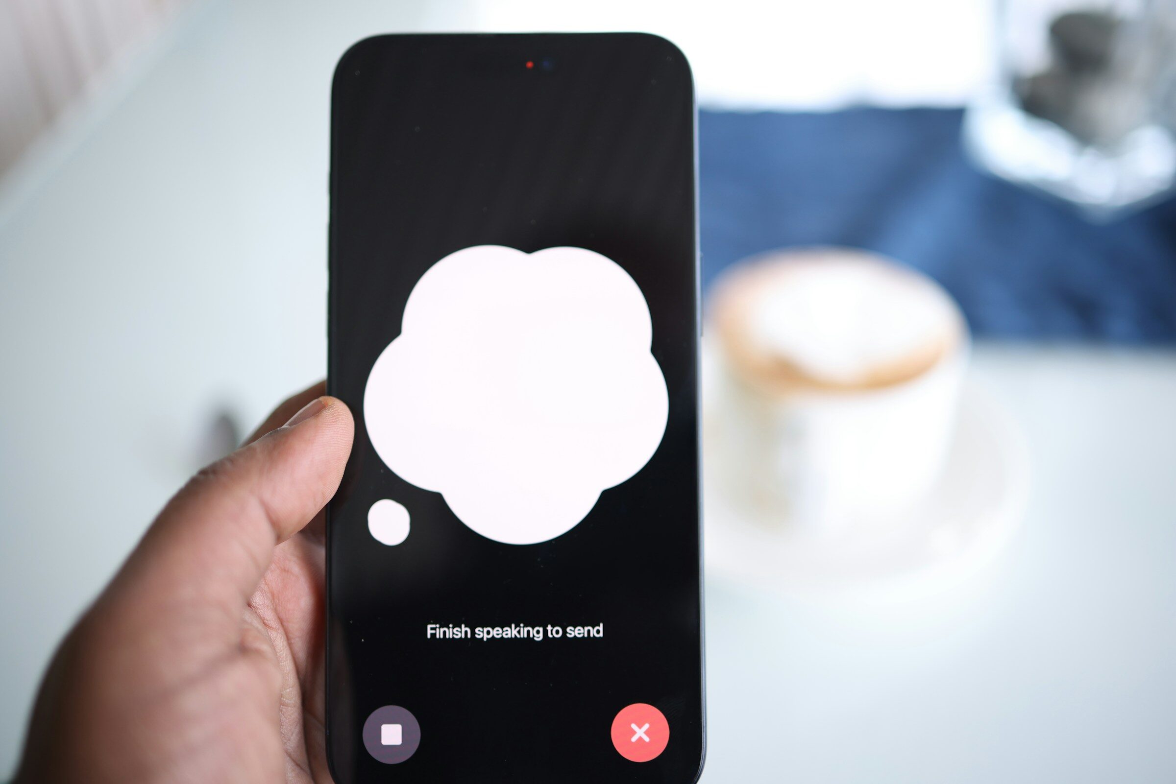 A phone showing a speech bubble on screen