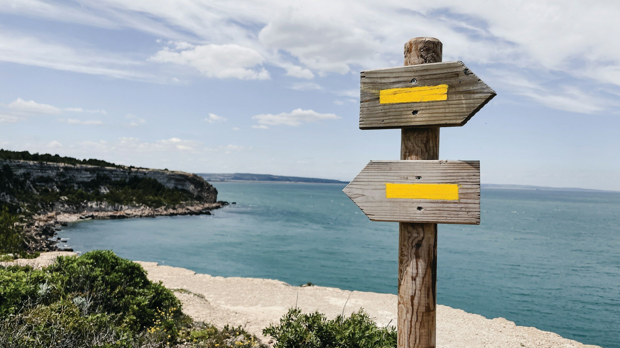 A wooden sign pointing in two directions