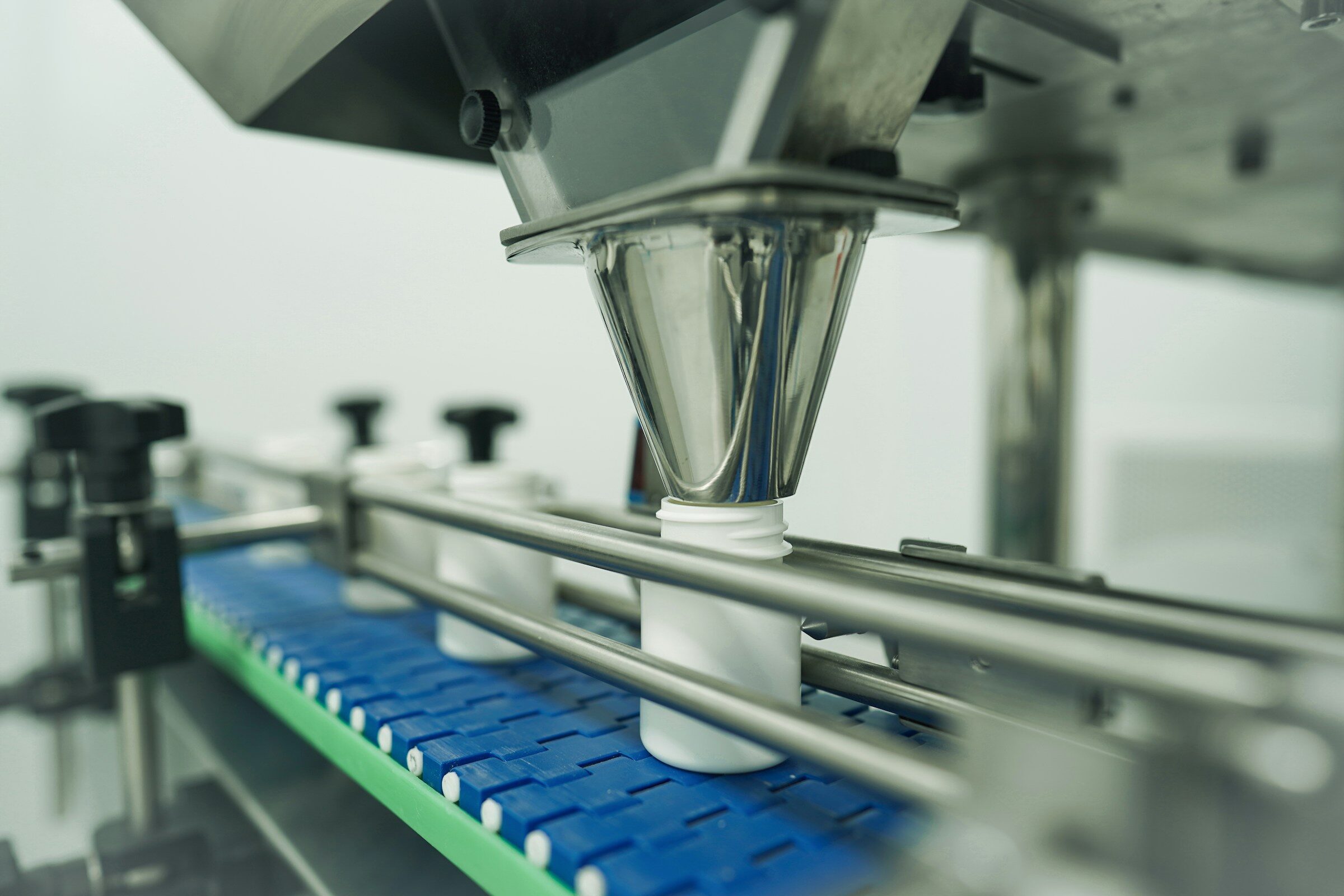 Bottles being filled on an automated production line