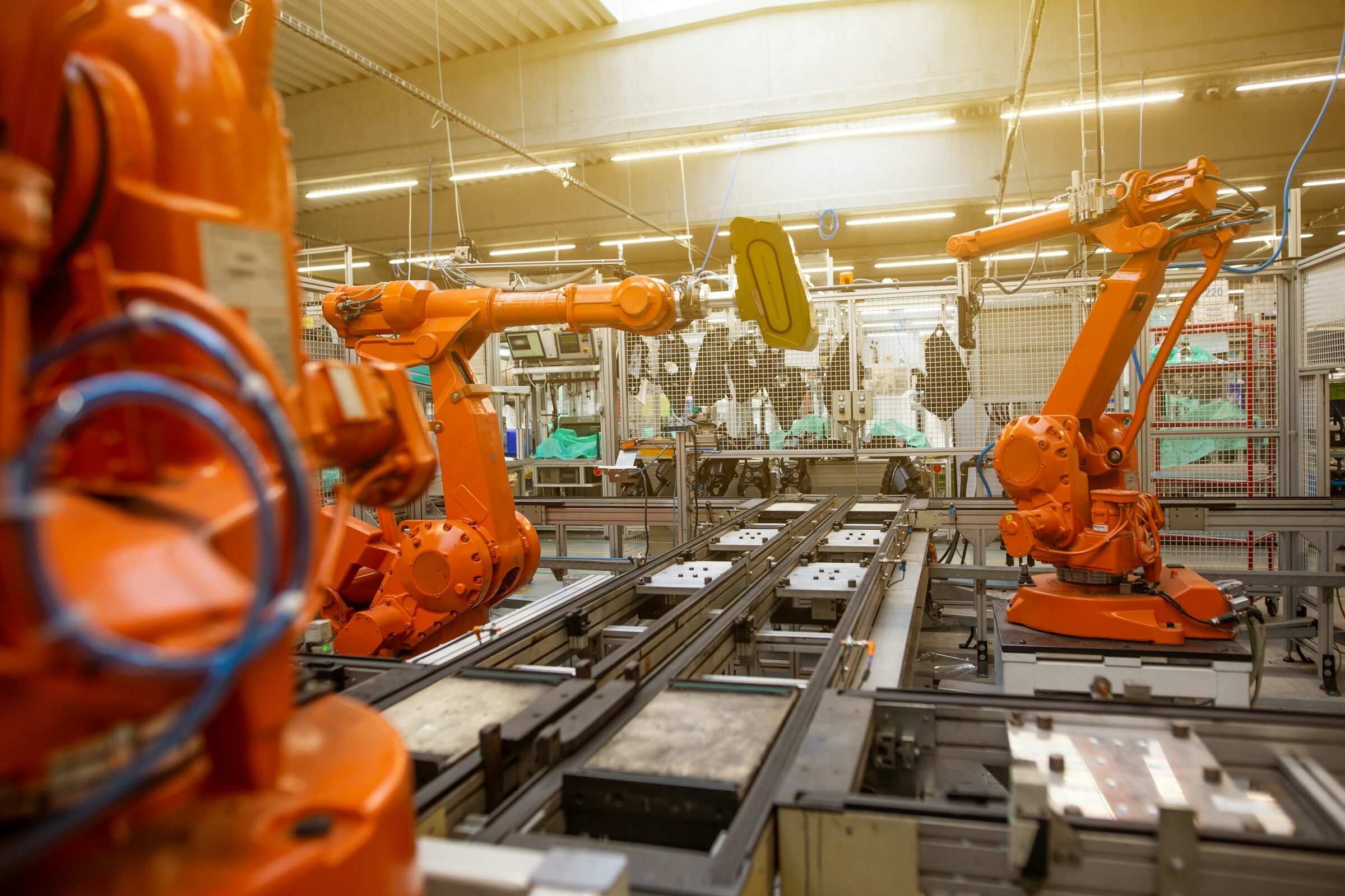 A line of production machines running inside a manufacturing plant
