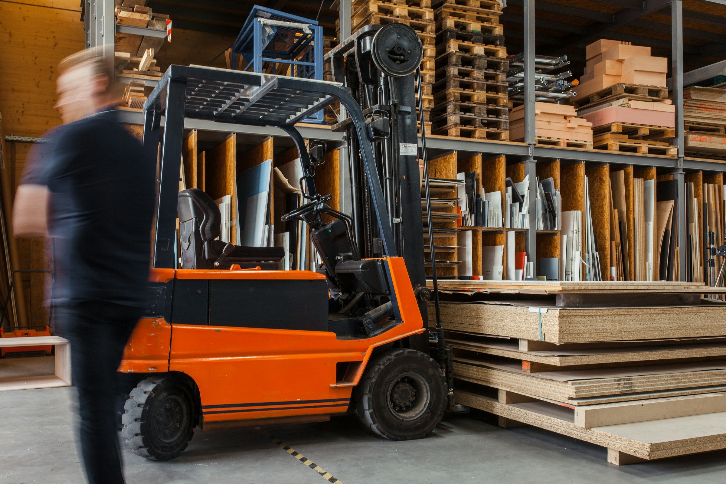 Forklift moving stock inside a warehouse