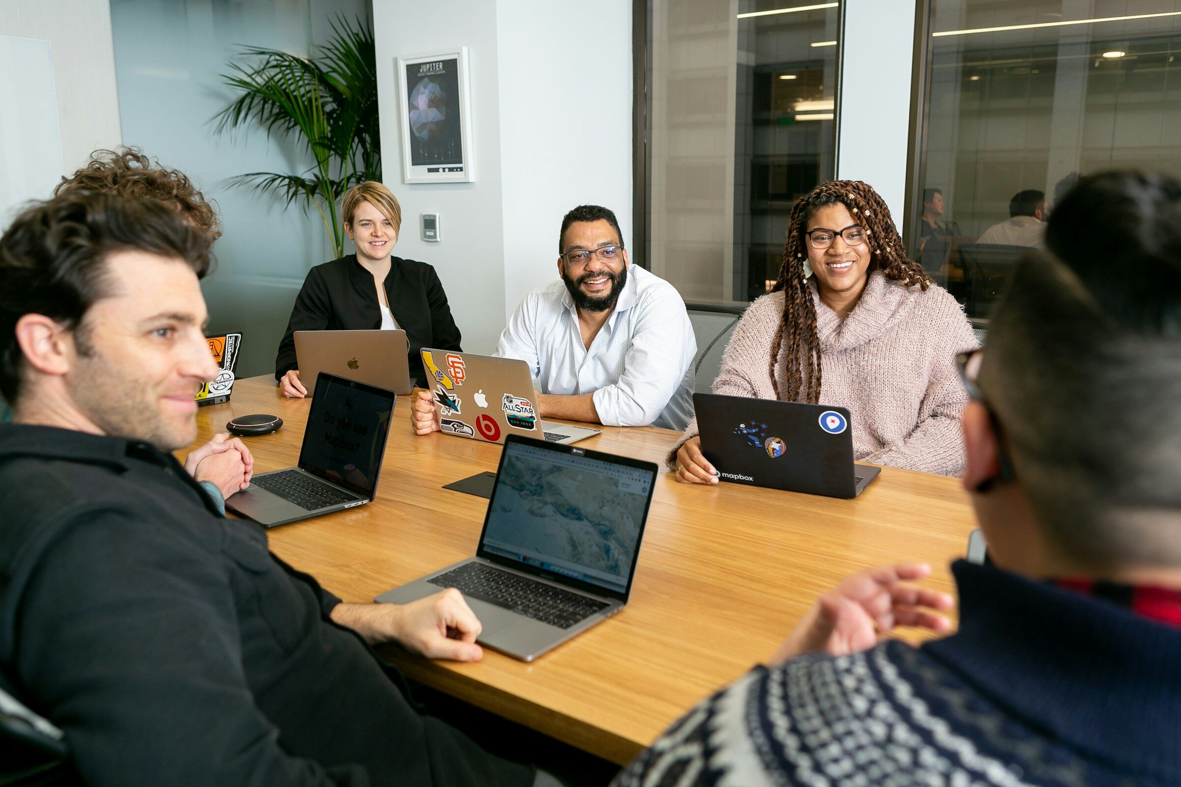 A management team reviewing figures from several branches