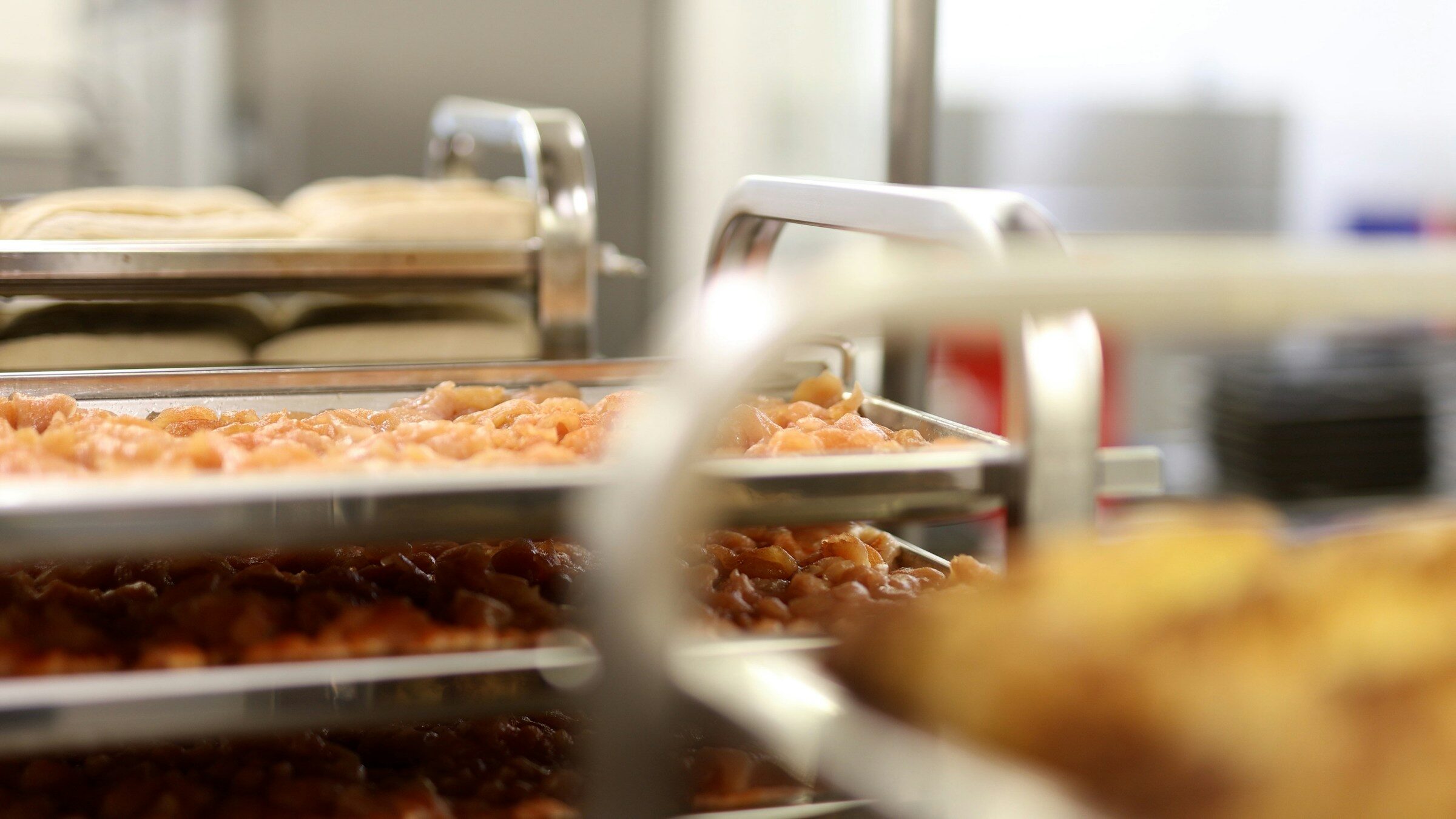 Fresh pasta being made in a commercial production kitchen