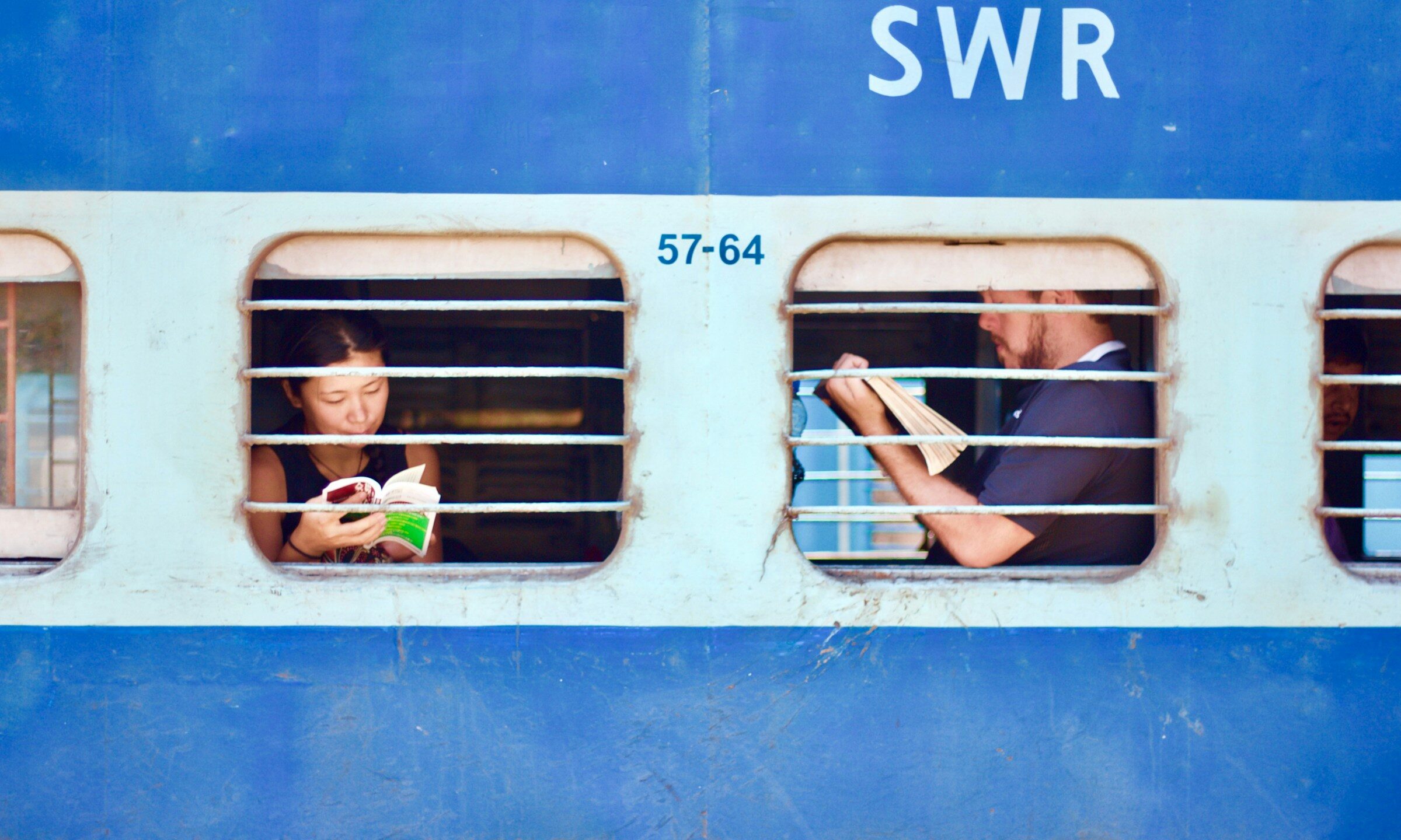 Two passengers on a Thames Valley commuter train