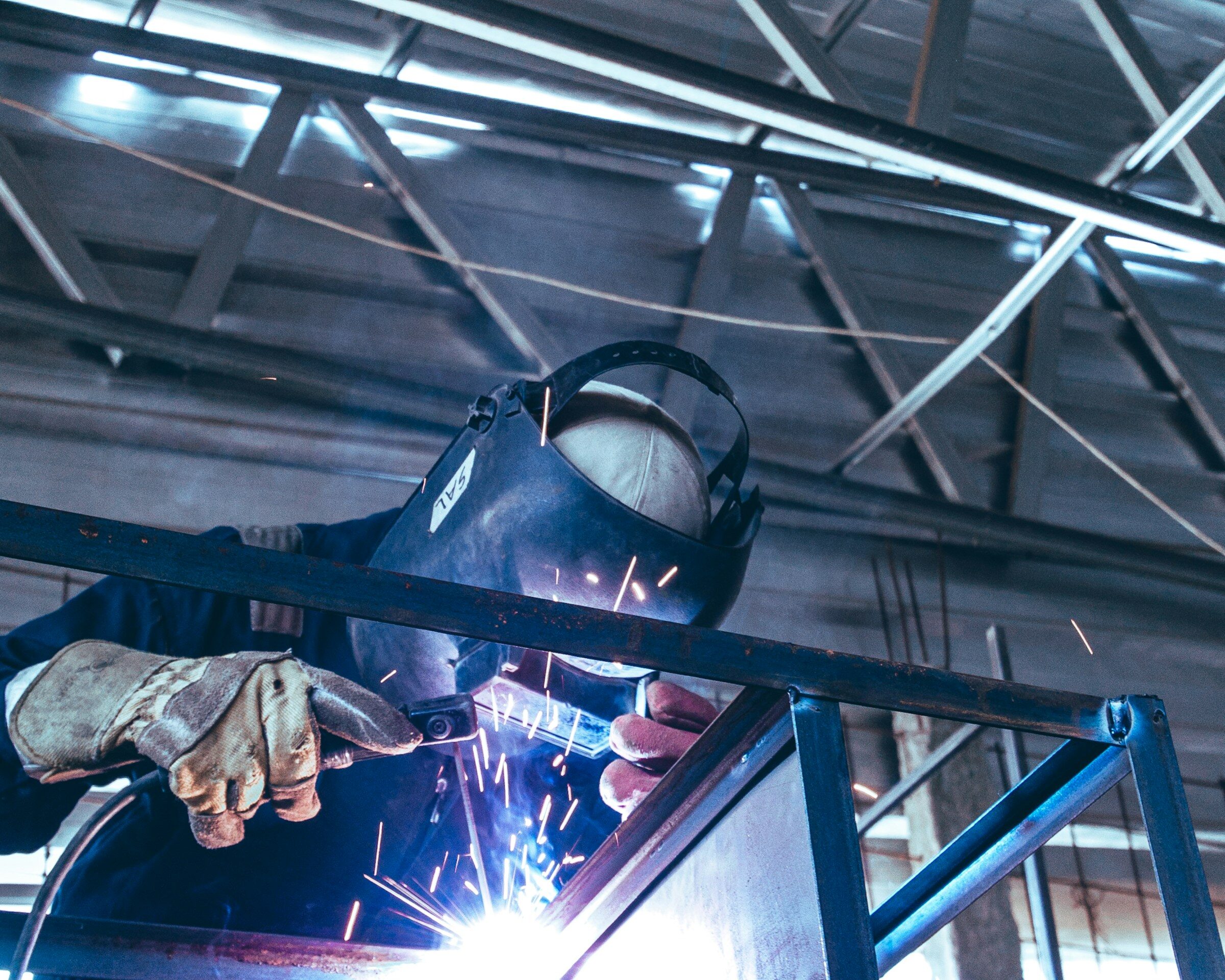 A welder running a seam on steel