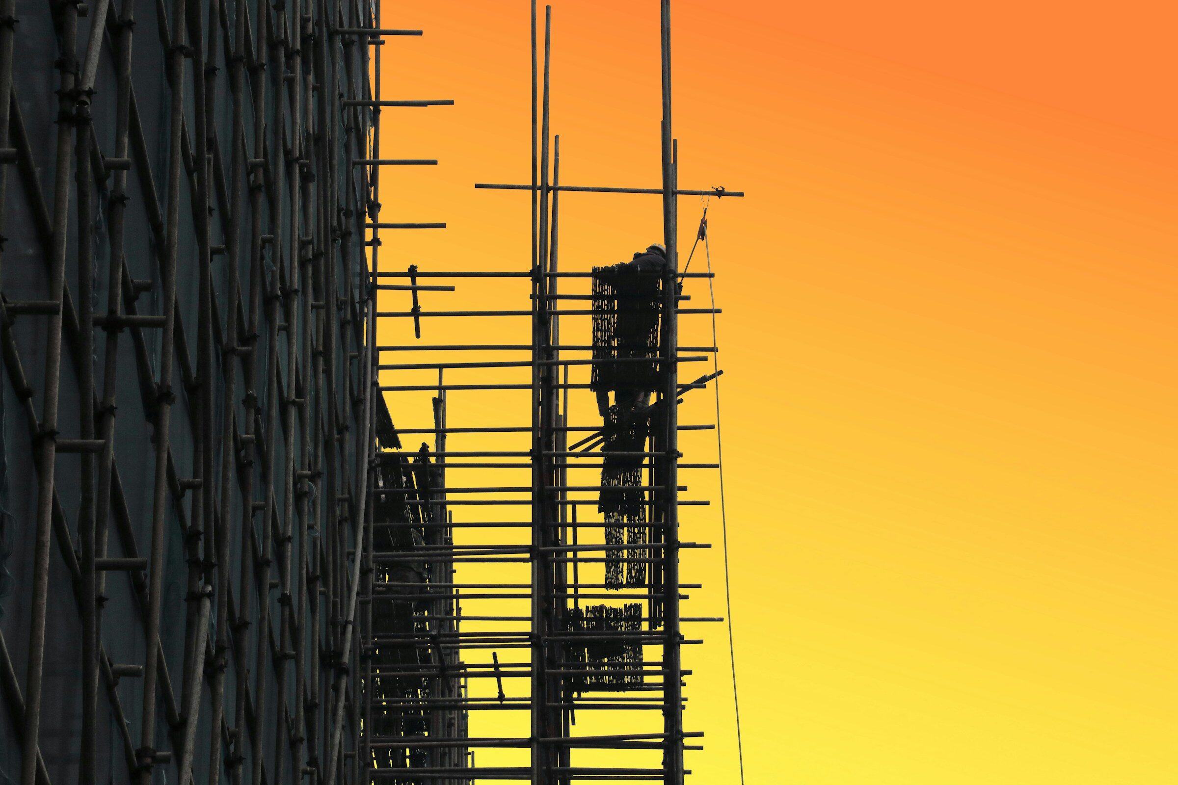 Scaffolding silhouetted at golden hour
