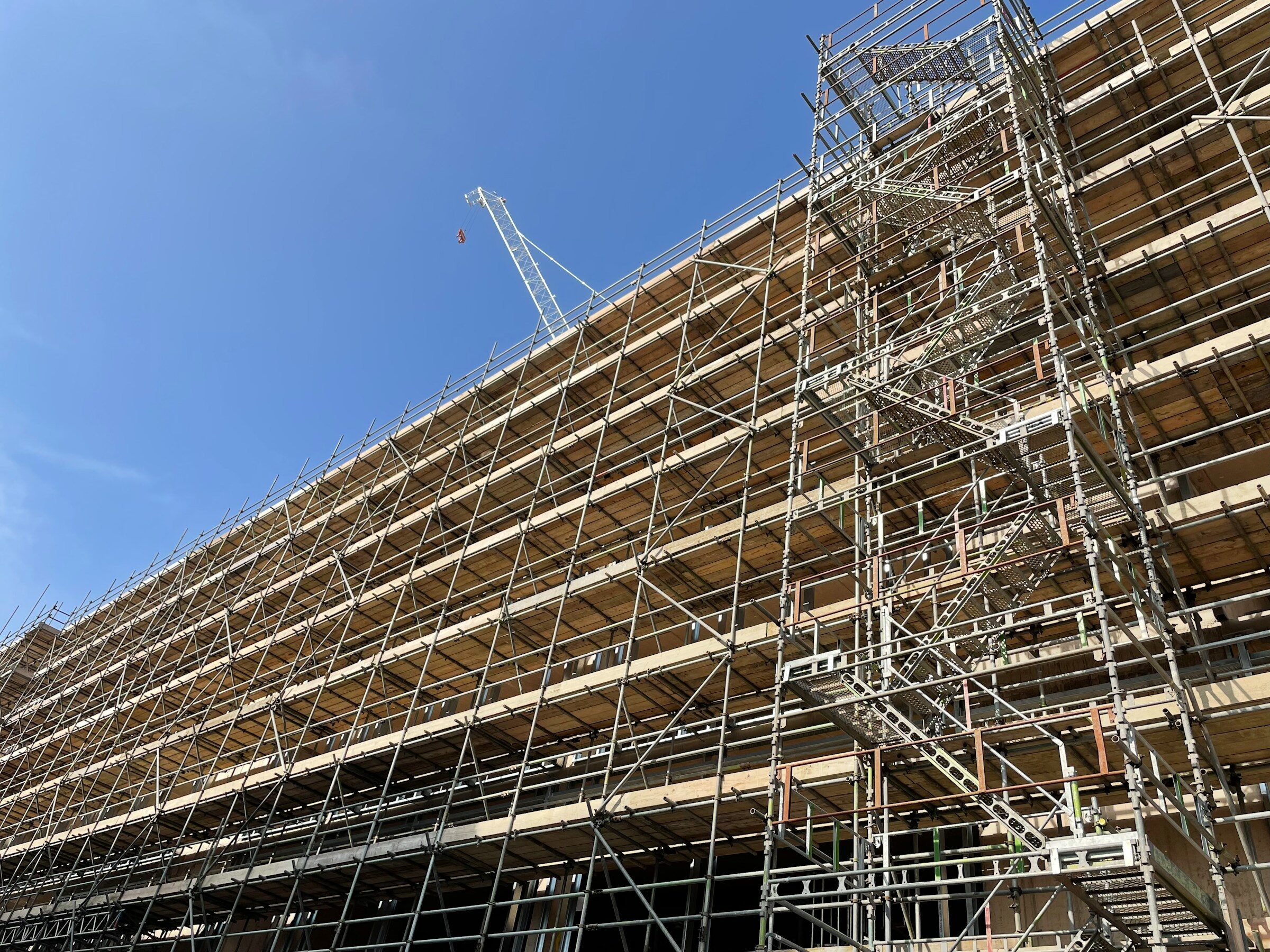 A tall building wrapped in scaffolding