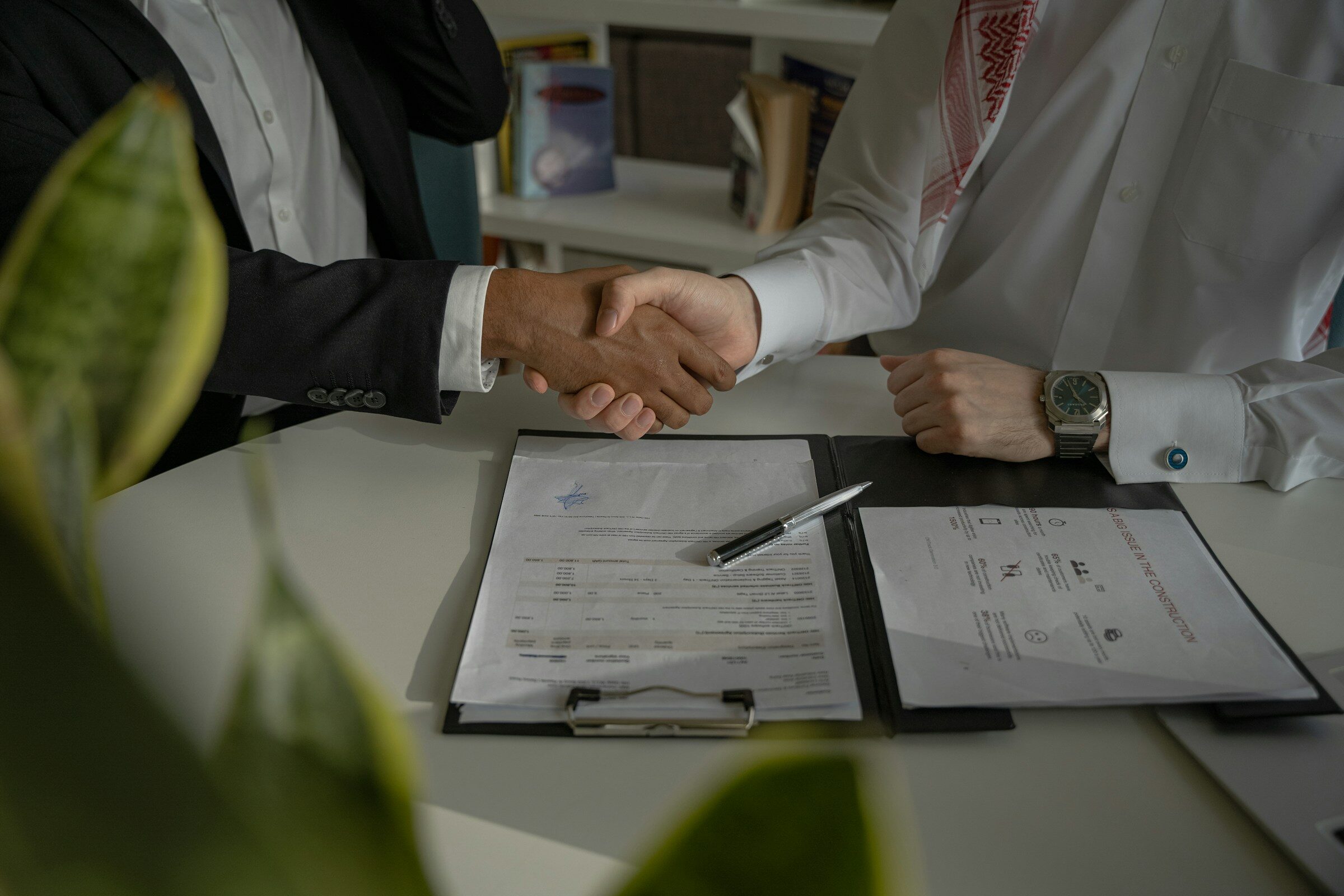 A handshake over a signed document