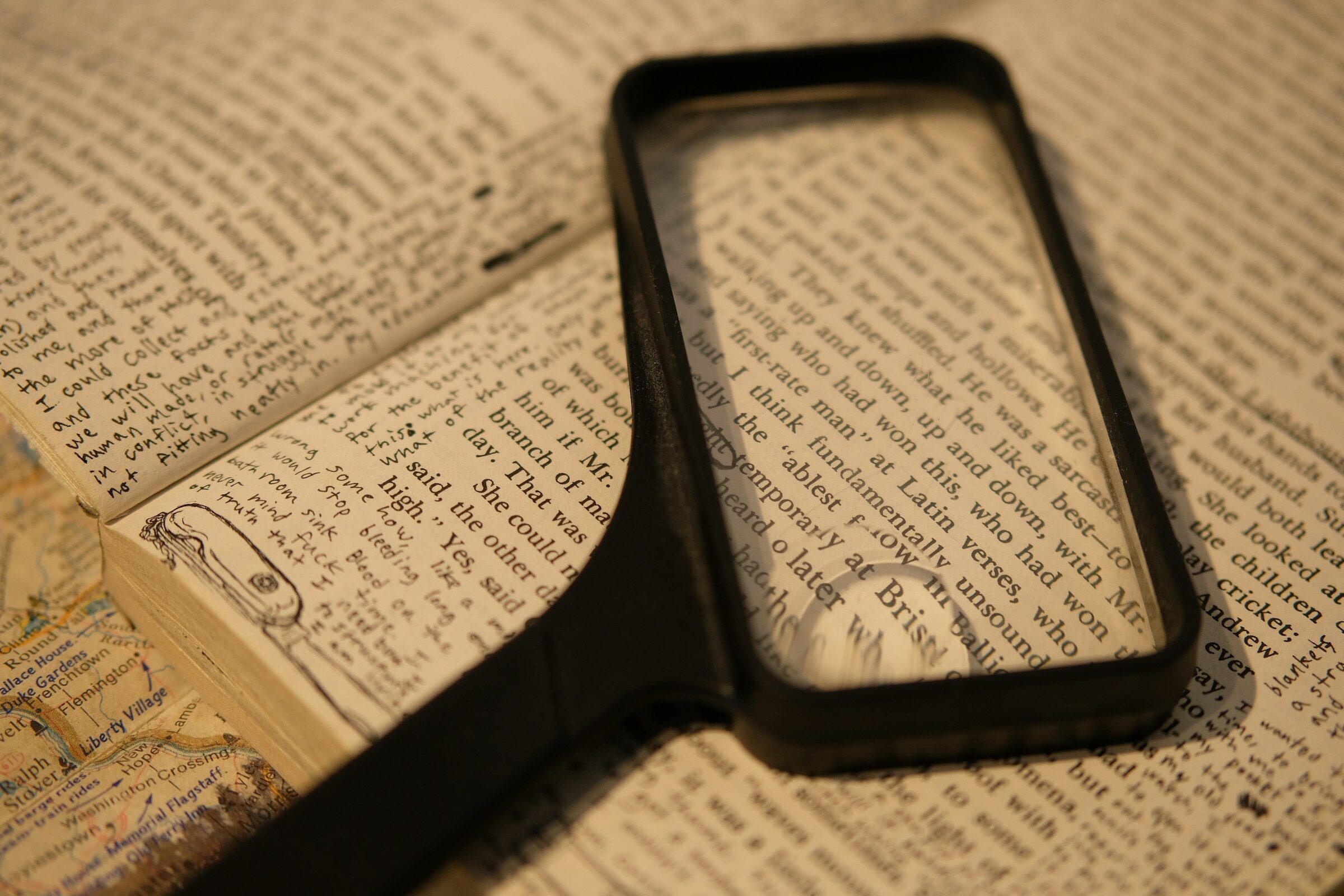 A magnifying glass held over an open book